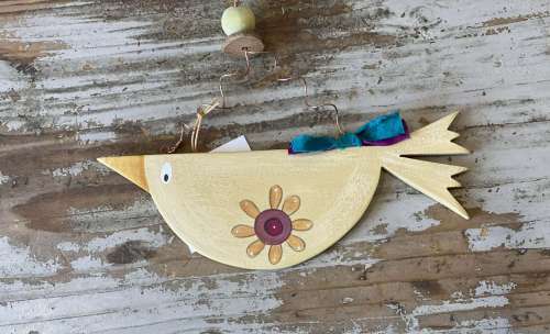 κοτσύφι κίτρινο με λουλούδι